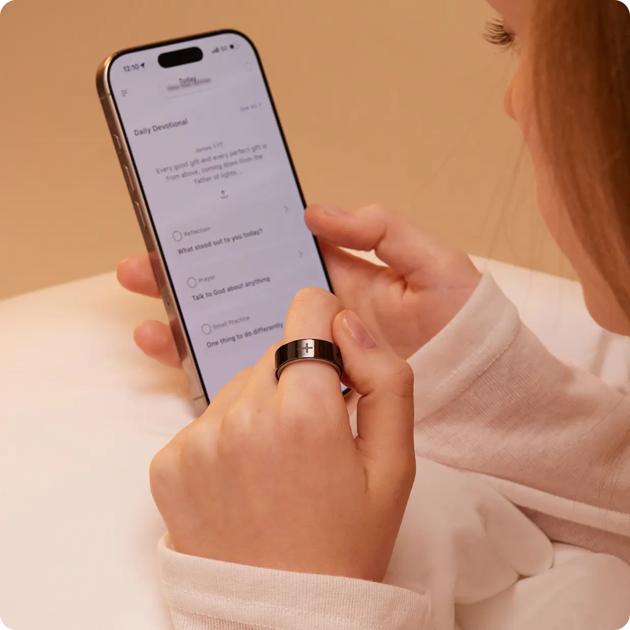 Woman scrolling evening devotional on phone